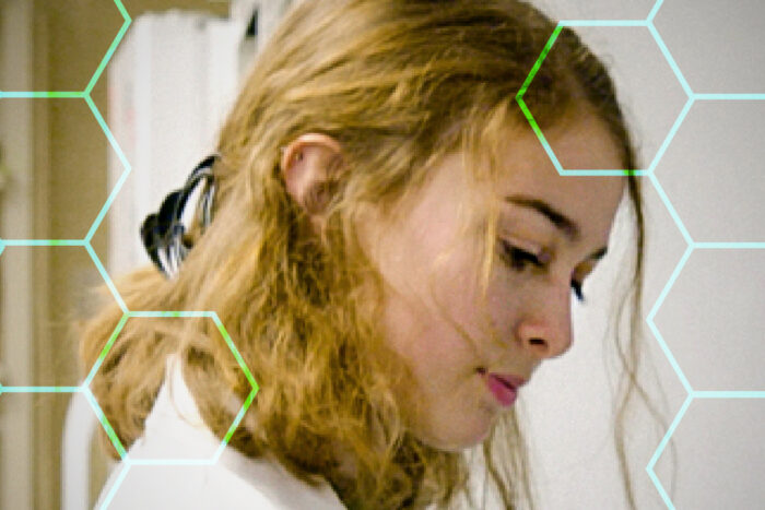 Scientist working in lab wearing white lab coat