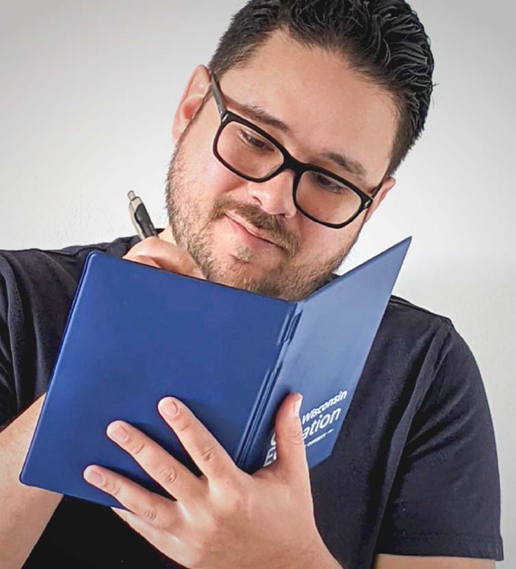Scientist logging data in a log book