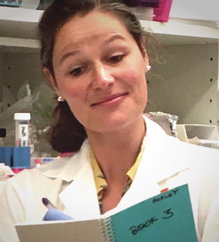 Scientist logging notes in notebook