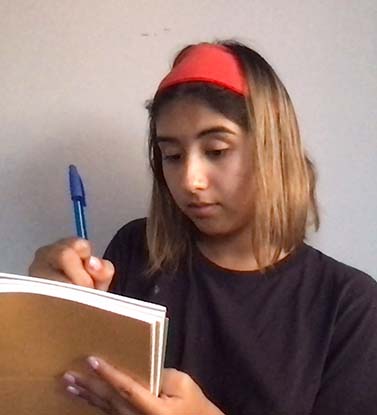 Scientist writing notes in a notebook