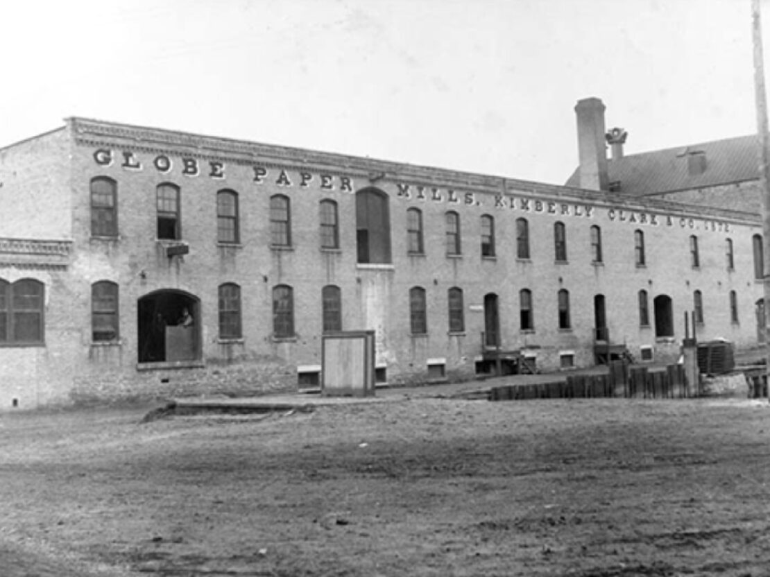 A black and white photo of the exterior of the Globe Mill building.