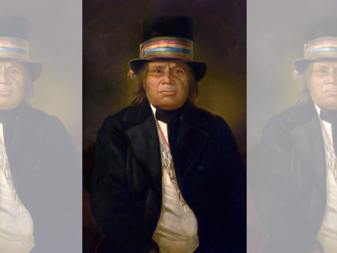 A painted portrait of Chief Oshkosh wearing a top hat, white shirt, and black coat.