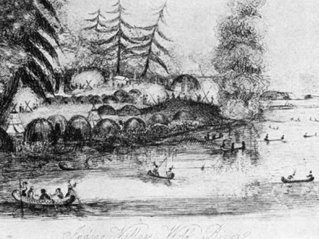 A black and white image showing a series of domed lodge structures along a river, with two canoes with people in them in the river.
