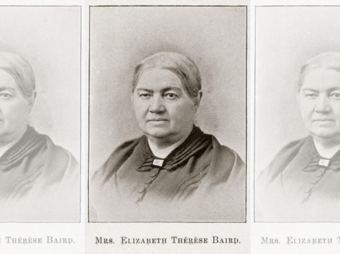 A black and white photograph portrait of Elizabeth Baird. Her head and shoulders are visible. She looks to the left of the viewer. Her mouth is closed in a calm expression.