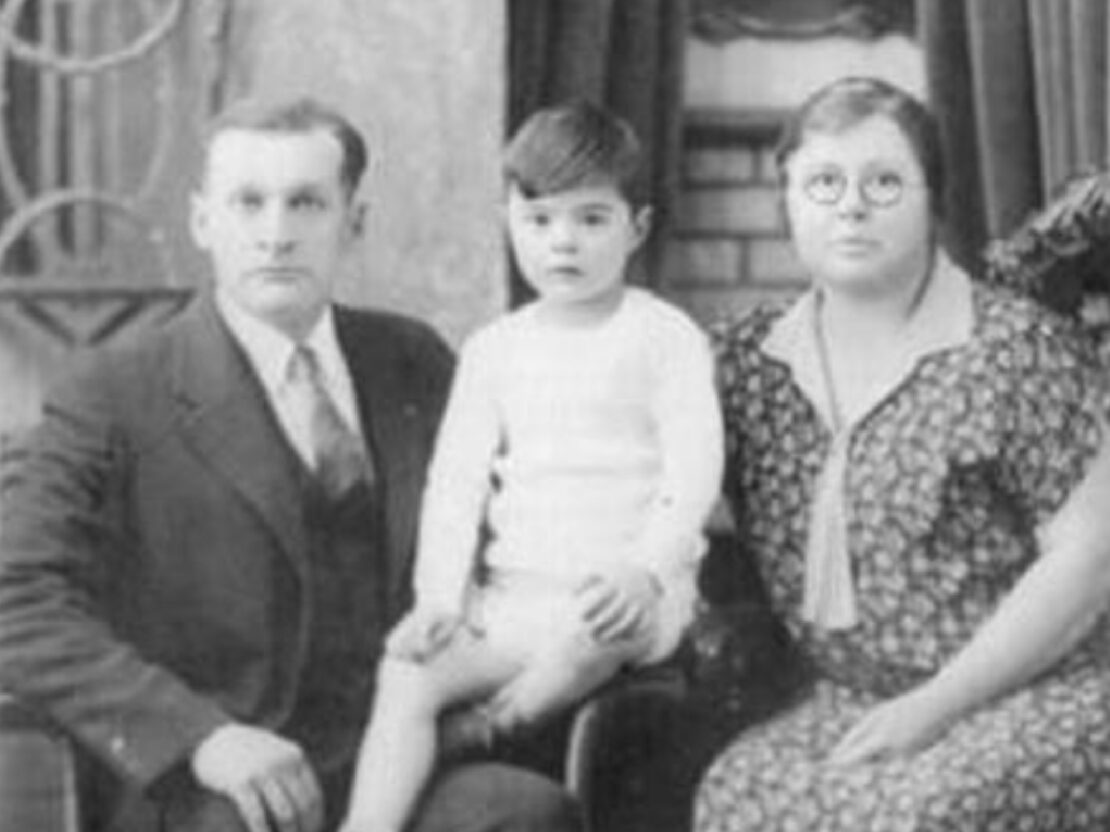 A black and white photograph of Bill, Tommy and Kate. All three are seated and looking towards the viewer.