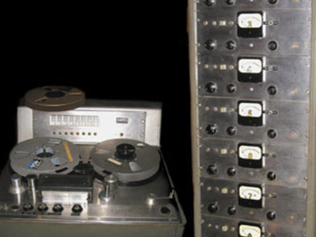 A color image showing a metal tower and recorder.