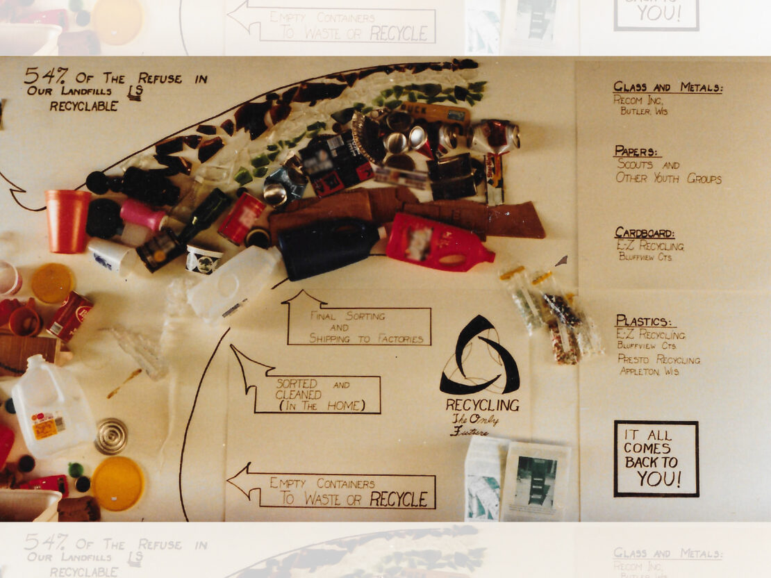 A color image showing a poster with pieces of different materials attached to it.