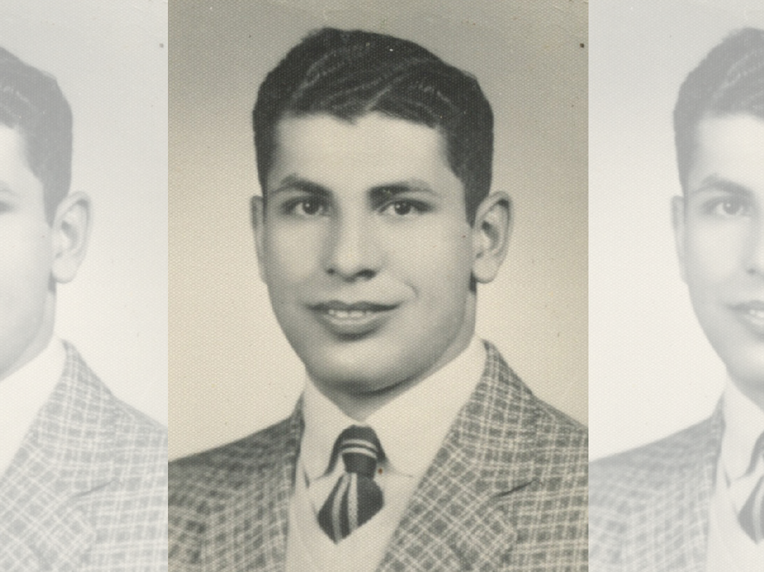 A black and white photograph of Mahmoud Othman Atta as a young man. He is wearing a patterned suit jacket and tie.
